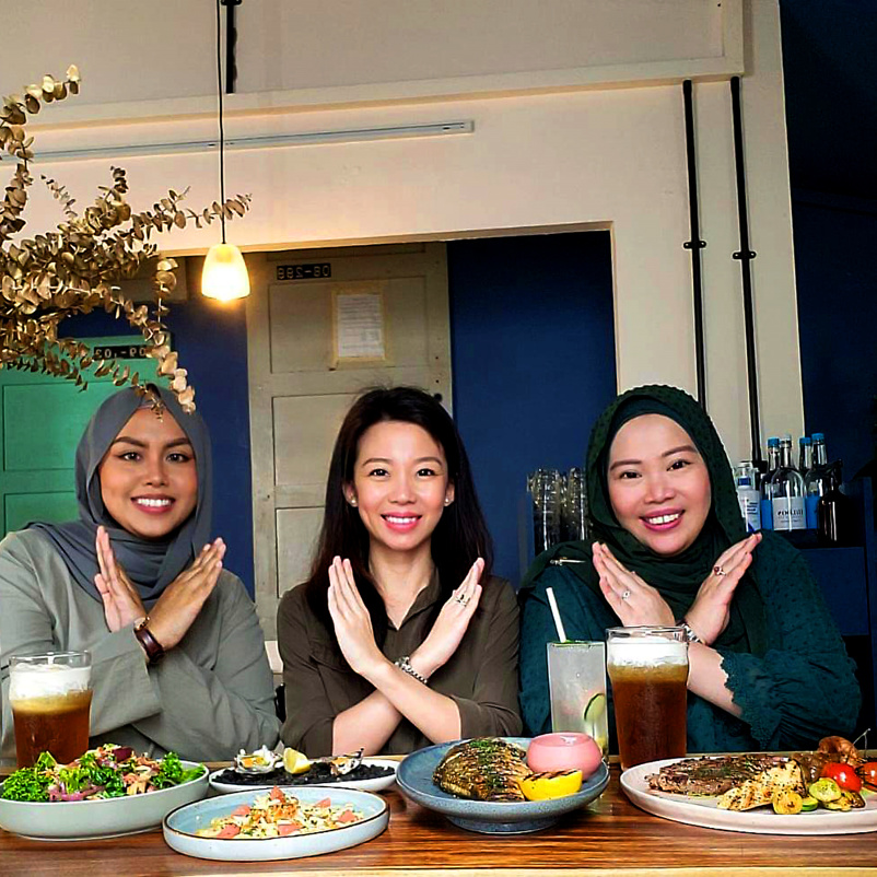 Three women posing for international women's day
